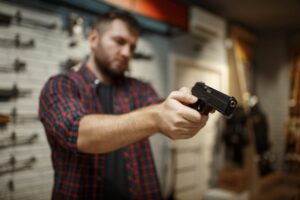 man-aims-with-two-handguns-in-gun-shop-2021-08-27-12-28-31-utc